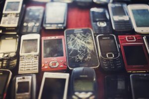 News & Announcements Collection of old and damaged mobile phones arranged for e-waste recycling.